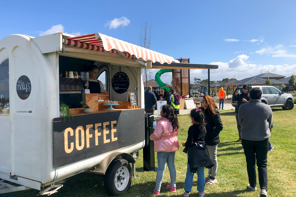 Image of a family lining up at a mobile coffee van at the Orchard Park Festival